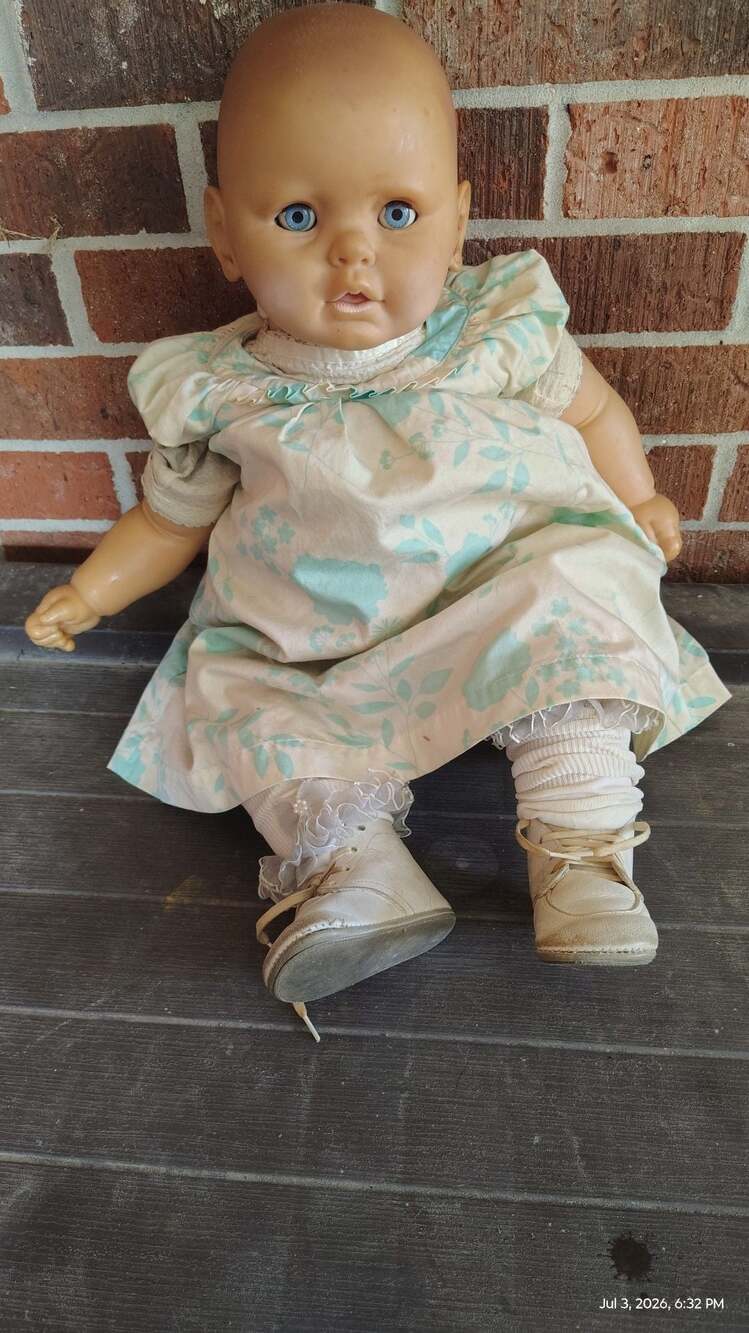 Vintage Vinyl Baby Doll with Blue Sleep Eyes and Floral Dress